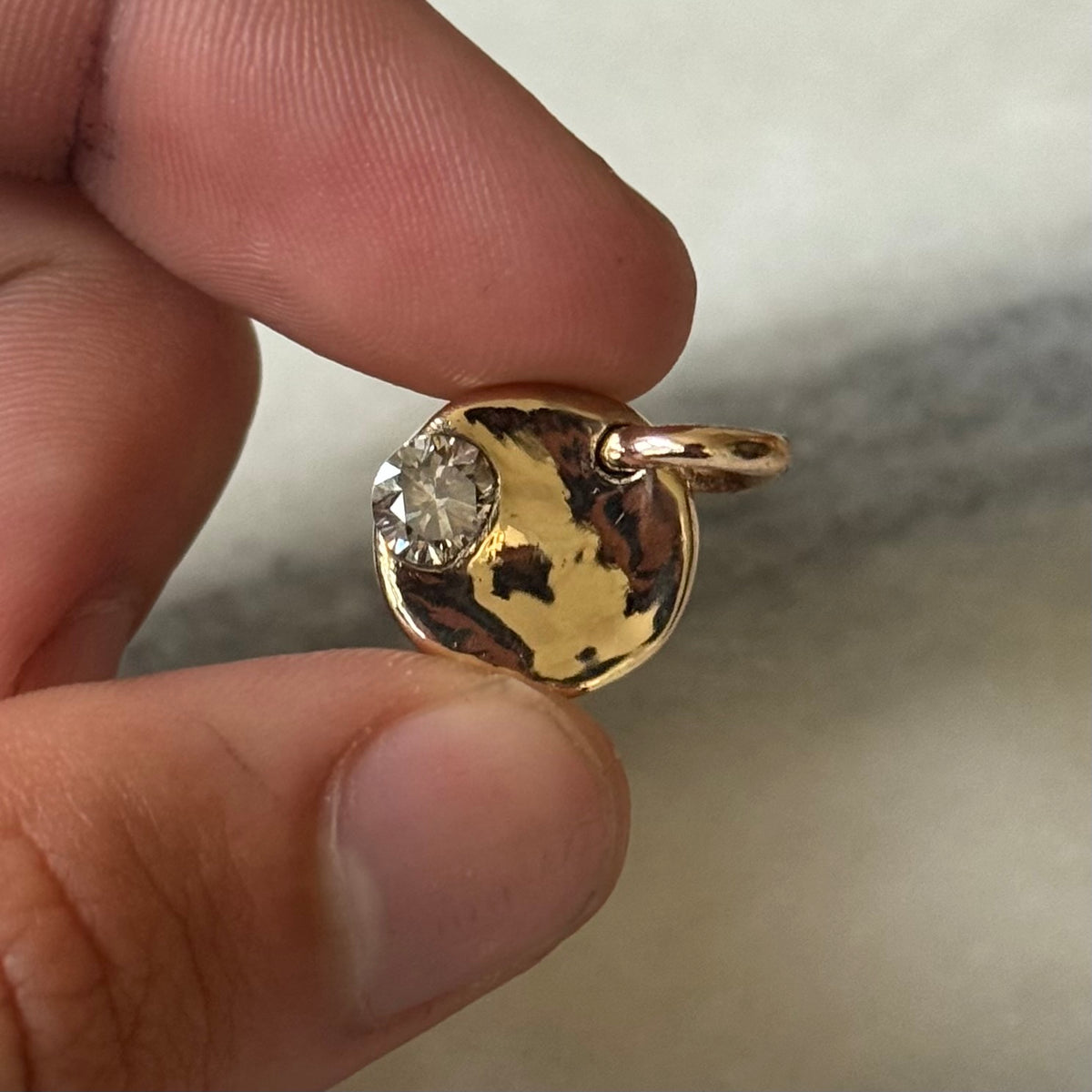 round gold pendant