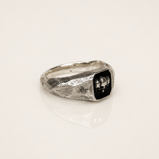 skull signet ring sterling silver with rough texture 